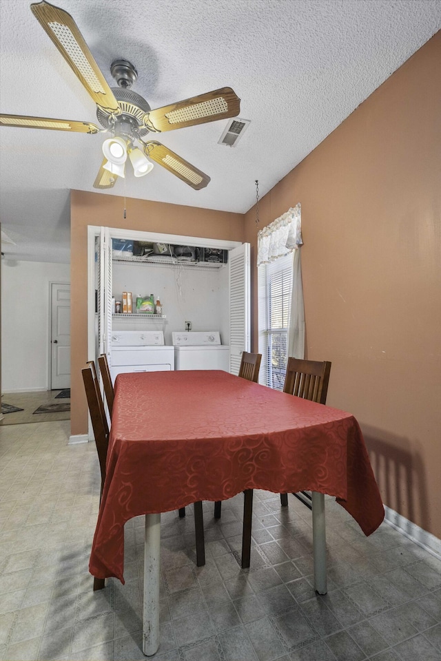 dining room featuring ceiling fan, separate washer and dryer, radiator heating unit, and a textured ceiling