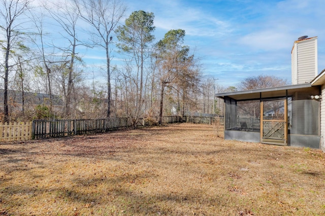 view of yard with a sunroom