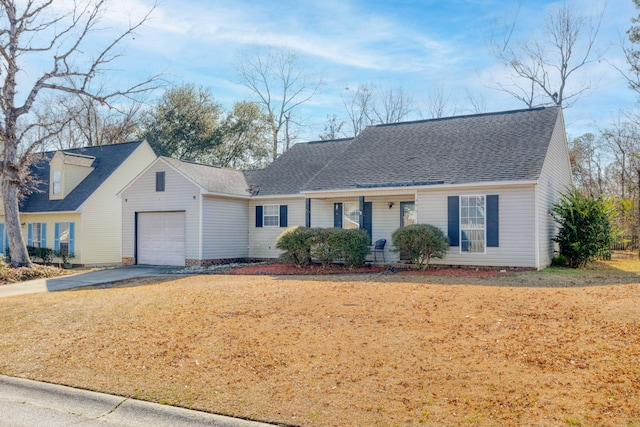 view of front of property featuring a garage and a front yard