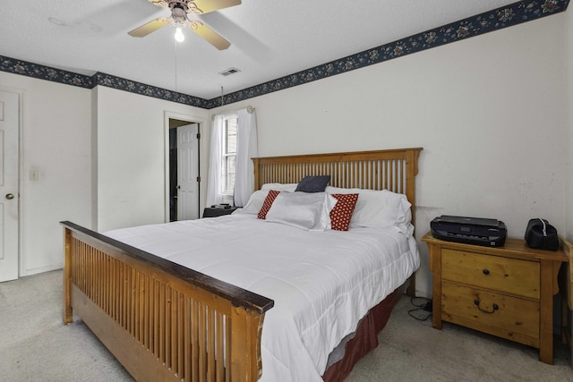 bedroom with light colored carpet and ceiling fan