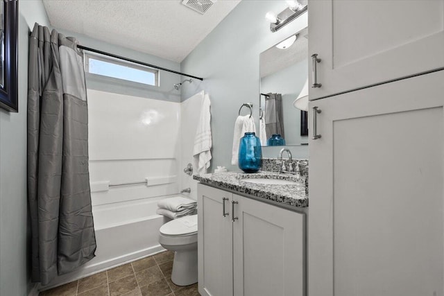 bathroom featuring a textured ceiling, toilet, visible vents, vanity, and shower / tub combo with curtain