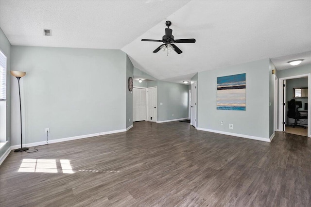 unfurnished living room with lofted ceiling, wood finished floors, a ceiling fan, and baseboards