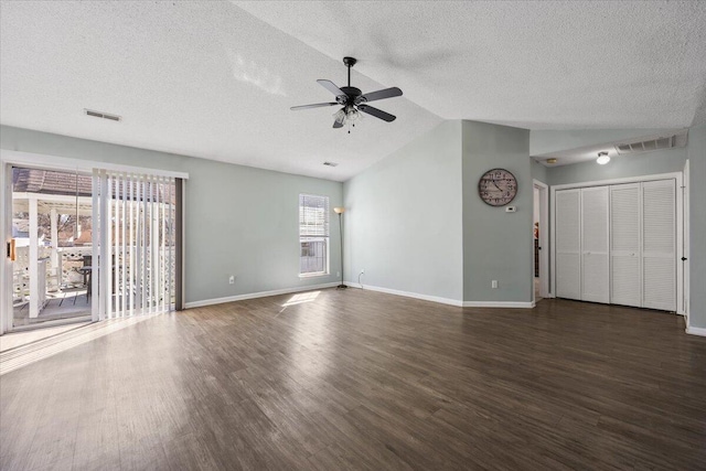 unfurnished living room with lofted ceiling, visible vents, and dark wood finished floors