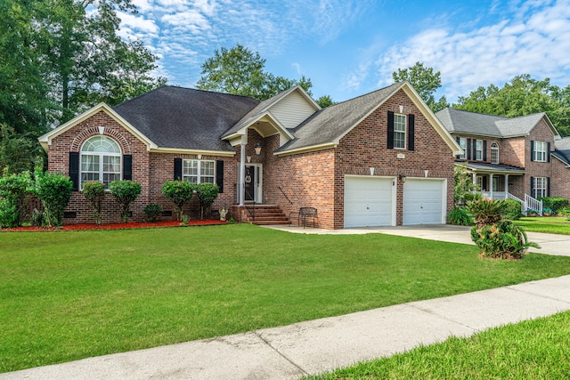 view of front of house featuring a front yard and a garage