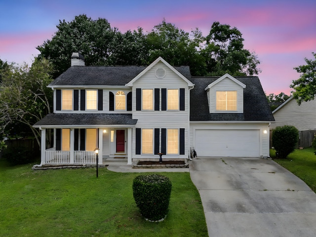 103 Retriever Ln, Goose Creek, SC 29445 - view of front facade featuring concrete driveway, covered porch, a lawn, a garage, and a chimney