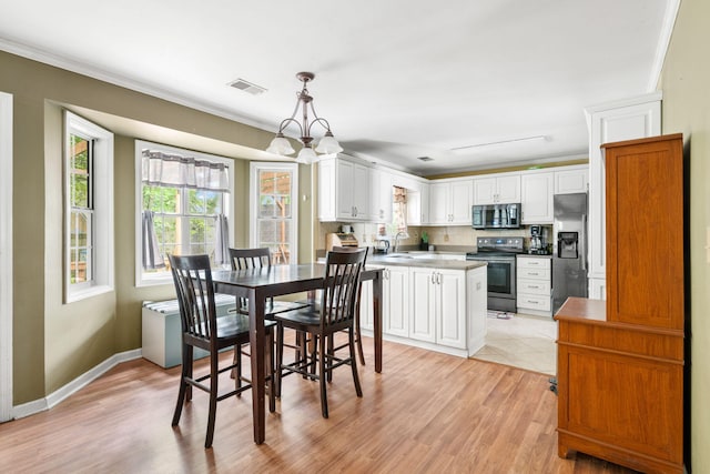 103 Retriever Ln, Goose Creek, SC 29445 - dining room with light wood-style flooring, ornamental molding, baseboards, and a chandelier