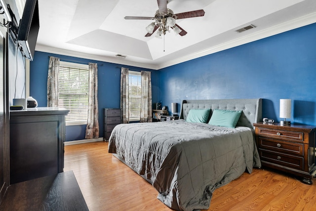 103 Retriever Ln, Goose Creek, SC 29445 - bedroom featuring a raised ceiling, wood finished floors, crown molding, a ceiling fan, and baseboards