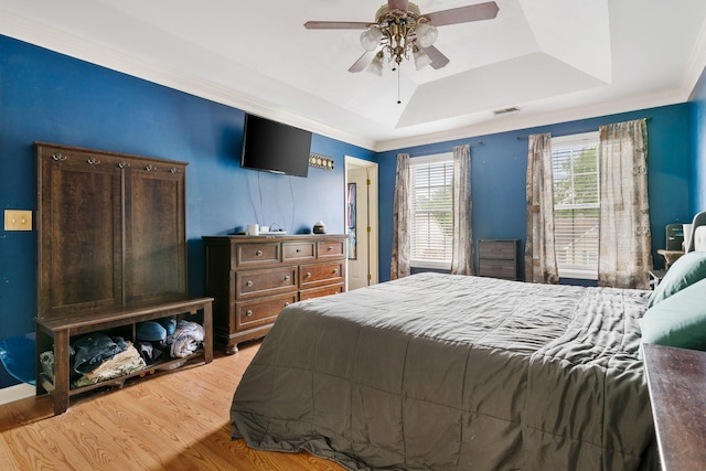 103 Retriever Ln, Goose Creek, SC 29445 - bedroom with a raised ceiling, light wood-style flooring, and a ceiling fan