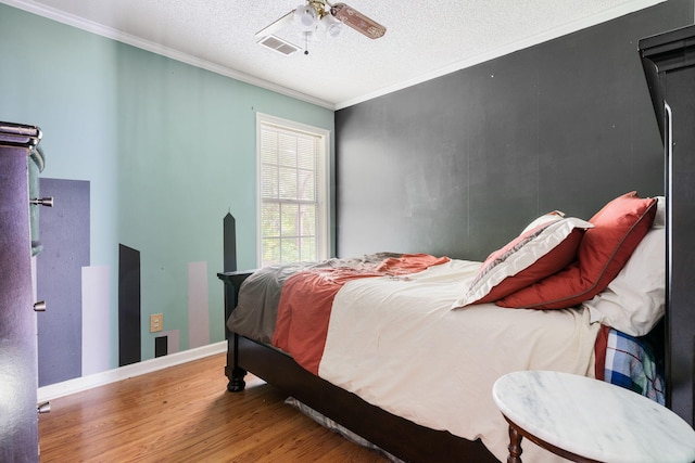 103 Retriever Ln, Goose Creek, SC 29445 - bedroom with wood finished floors, crown molding, a textured ceiling, a ceiling fan, and baseboards