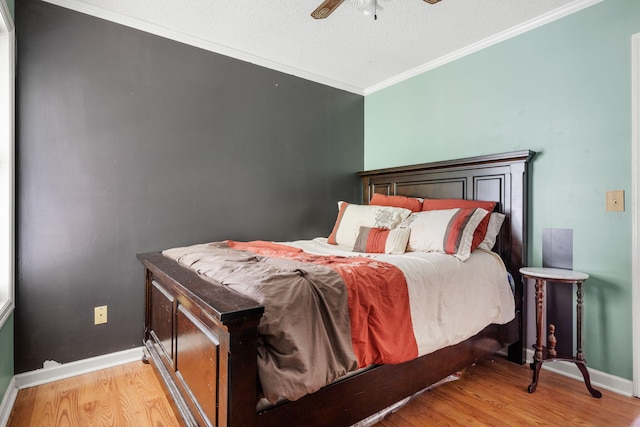 103 Retriever Ln, Goose Creek, SC 29445 - bedroom with light wood finished floors, ornamental molding, baseboards, ceiling fan, and a textured ceiling