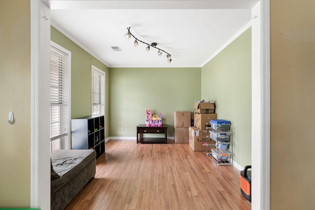 103 Retriever Ln, Goose Creek, SC 29445 - living area with wood finished floors, crown molding, track lighting, and baseboards