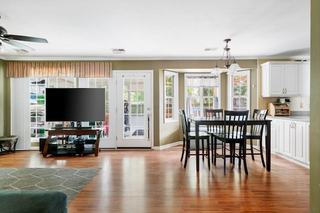 103 Retriever Ln, Goose Creek, SC 29445 - dining room with wood finished floors, a chandelier, a ceiling fan, and ornamental molding