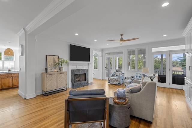 228 Beresford Creek St, Charleston, SC 29492 - living room with ornamental molding, ceiling fan, a fireplace, light wood-type flooring, and recessed lighting