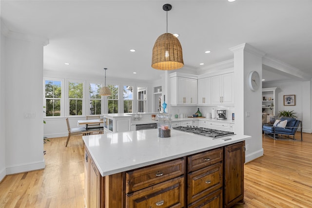 228 Beresford Creek St, Charleston, SC 29492 - kitchen with appliances with stainless steel finishes, white cabinetry, light countertops, a peninsula, and light wood-style floors