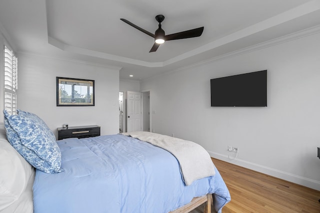 228 Beresford Creek St, Charleston, SC 29492 - bedroom featuring a raised ceiling, wood finished floors, ceiling fan, crown molding, and recessed lighting