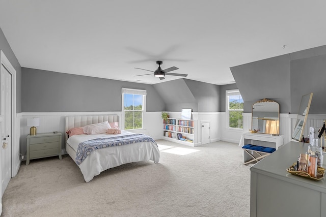 228 Beresford Creek St, Charleston, SC 29492 - bedroom with light carpet, multiple windows, a wainscoted wall, ceiling fan, and vaulted ceiling