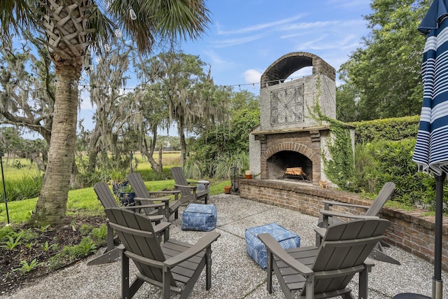 228 Beresford Creek St, Charleston, SC 29492 - view of patio with an outdoor brick fireplace