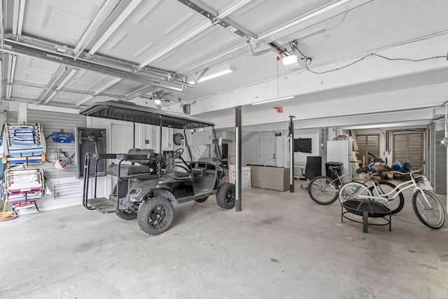228 Beresford Creek St, Charleston, SC 29492 - garage with freestanding refrigerator and a garage door opener