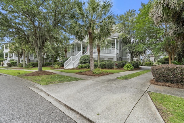 228 Beresford Creek St, Charleston, SC 29492 - multi unit property featuring a porch, stairs, and a front yard