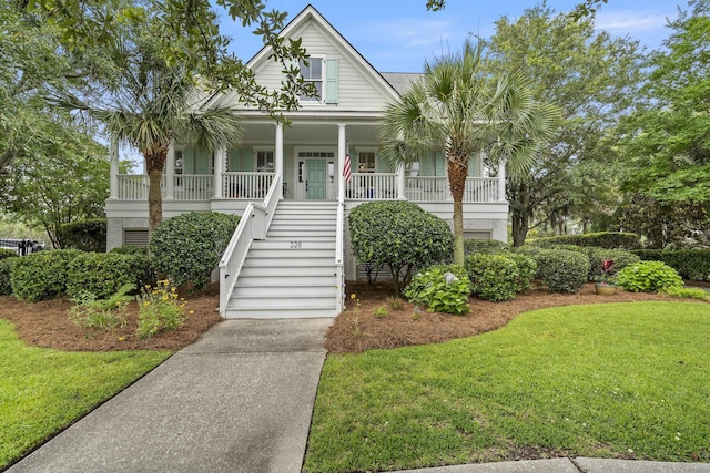 228 Beresford Creek St, Charleston, SC 29492 - beach home featuring a porch, stairway, and a front lawn