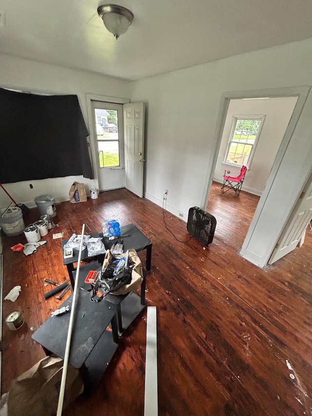 exercise room with dark wood-type flooring