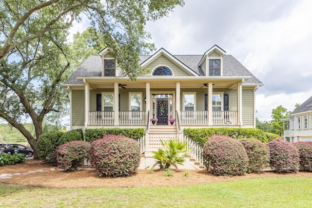 view of front of house featuring a front yard, a porch, and ceiling fan