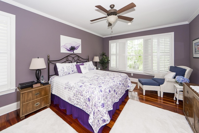 bedroom featuring ornamental molding, hardwood / wood-style flooring, and ceiling fan