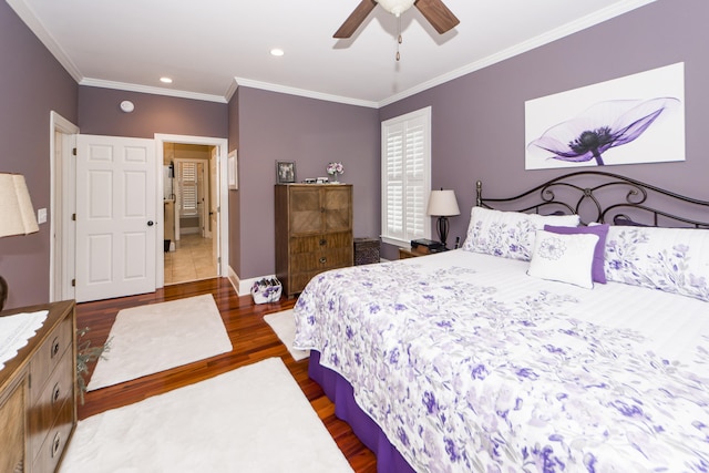 bedroom with ornamental molding, wood-type flooring, and ceiling fan