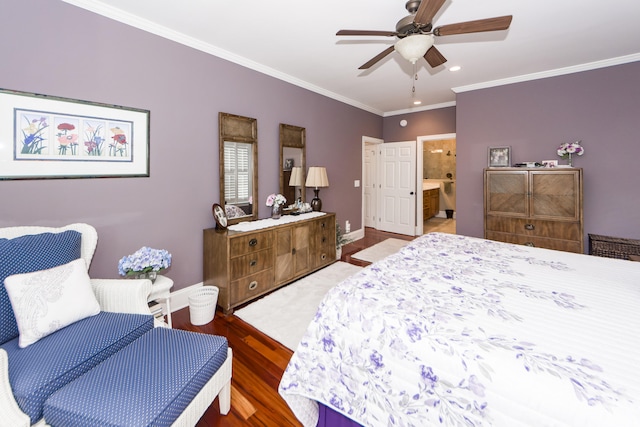 bedroom featuring crown molding, ensuite bath, wood-type flooring, and ceiling fan