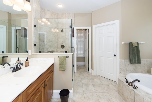 bathroom with vanity, independent shower and bath, and tile patterned floors