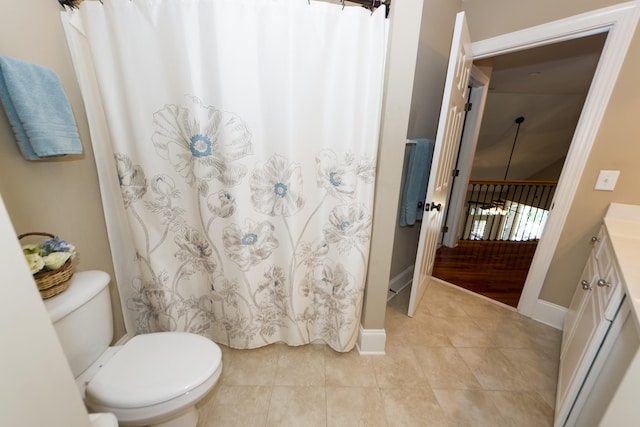 bathroom featuring toilet, a shower with curtain, vanity, and tile patterned flooring