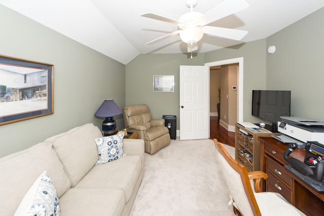 interior space with light carpet, ceiling fan, and vaulted ceiling