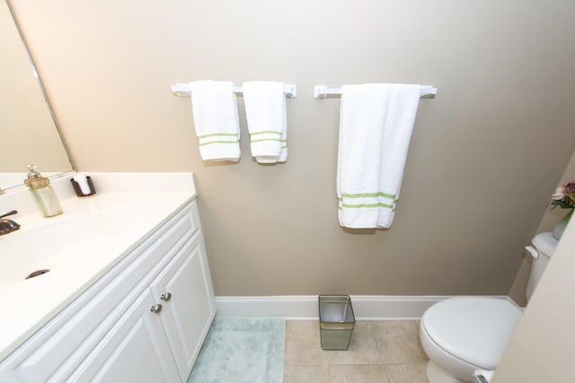 bathroom featuring vanity, toilet, and tile patterned floors