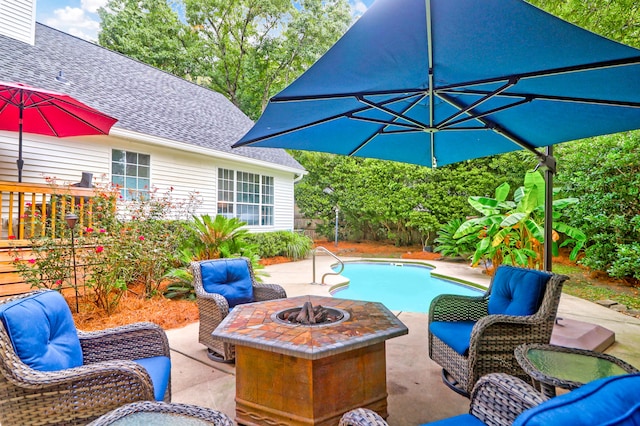 view of patio / terrace with an outdoor fire pit