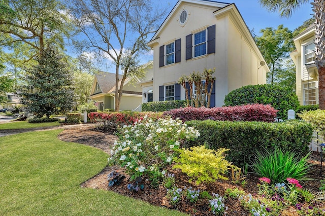 view of front of home with a front lawn