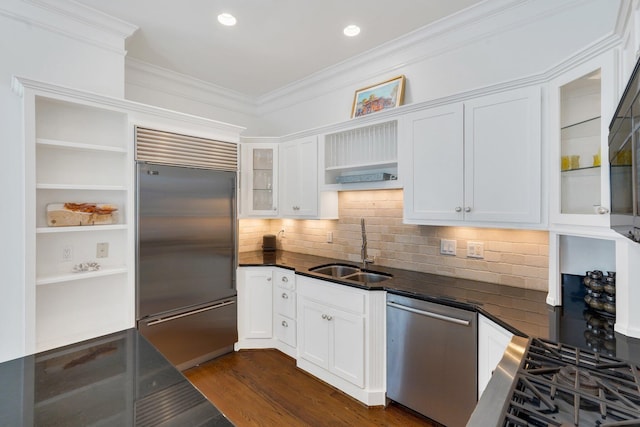 kitchen featuring open shelves, a sink, appliances with stainless steel finishes, dark countertops, and white cabinetry