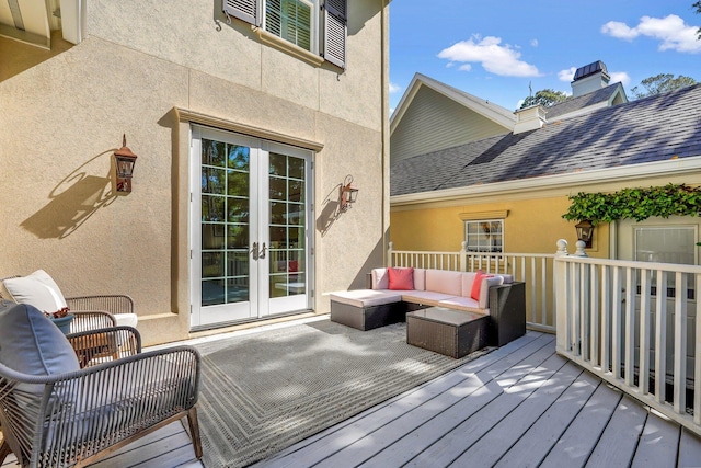 wooden deck with french doors and outdoor lounge area