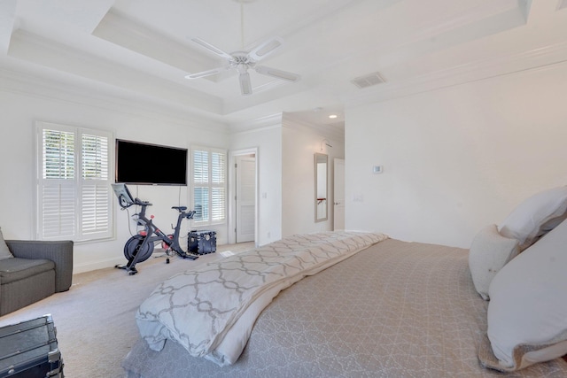 carpeted bedroom with a raised ceiling, multiple windows, crown molding, a ceiling fan, and recessed lighting