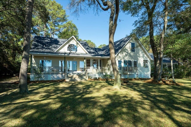 view of front facade with a front lawn and covered porch