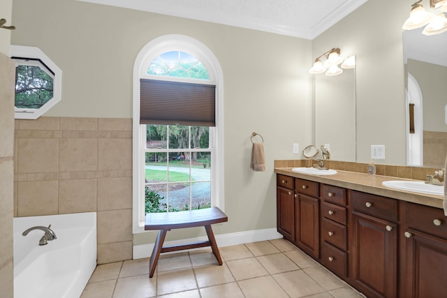 2494 Cape Rd, Johns Island, SC 29455 - full bath with tile patterned floors, double vanity, tile walls, a bath, and ornamental molding