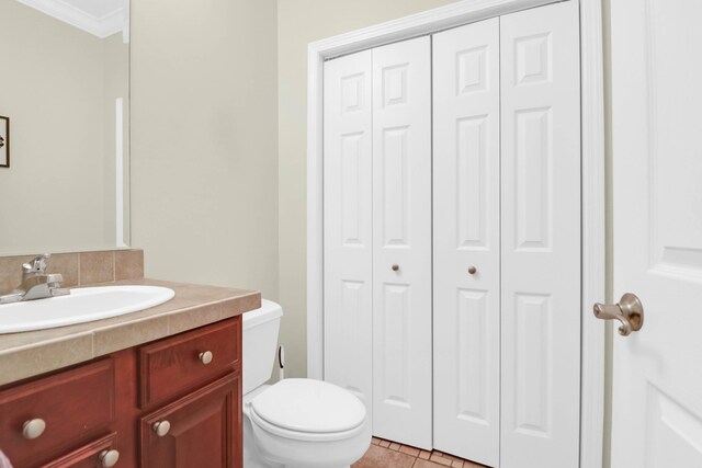 2494 Cape Rd, Johns Island, SC 29455 - bathroom with a closet, vanity, ornamental molding, and tile patterned flooring