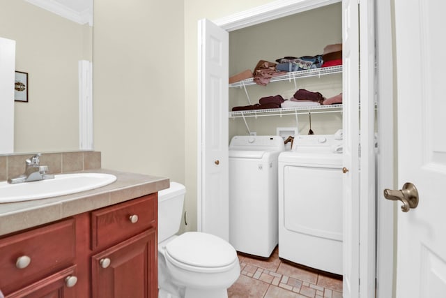 2494 Cape Rd, Johns Island, SC 29455 - bathroom featuring washer and clothes dryer, vanity, and crown molding