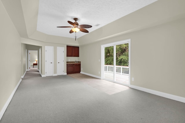 2494 Cape Rd, Johns Island, SC 29455 - unfurnished living room featuring light colored carpet, ceiling fan, and a textured ceiling