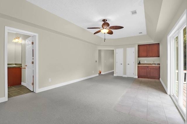 2494 Cape Rd, Johns Island, SC 29455 - unfurnished living room with ceiling fan, light tile patterned floors, healthy amount of natural light, and light colored carpet