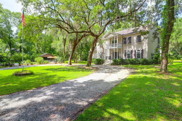 2494 Cape Rd, Johns Island, SC 29455 - view of front of home with a balcony, a front lawn, and driveway