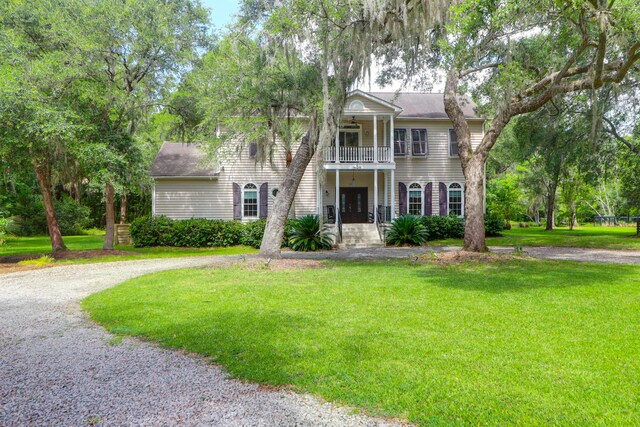 2494 Cape Rd, Johns Island, SC 29455 - neoclassical / greek revival house with a balcony, a front yard, and curved driveway