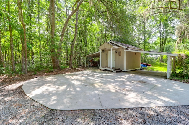 2494 Cape Rd, Johns Island, SC 29455 - view of patio / terrace featuring driveway and a forest view