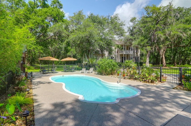 2494 Cape Rd, Johns Island, SC 29455 - view of swimming pool featuring a patio, outdoor dining space, and view of wooded area