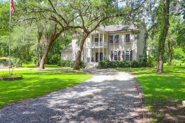 2494 Cape Rd, Johns Island, SC 29455 - view of front facade with a balcony and a front lawn