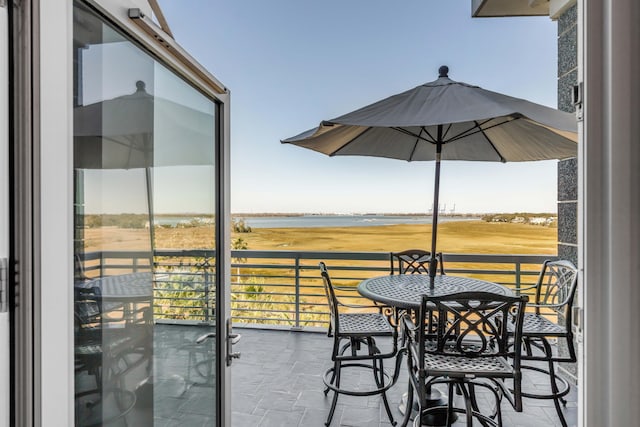 balcony featuring a water view
